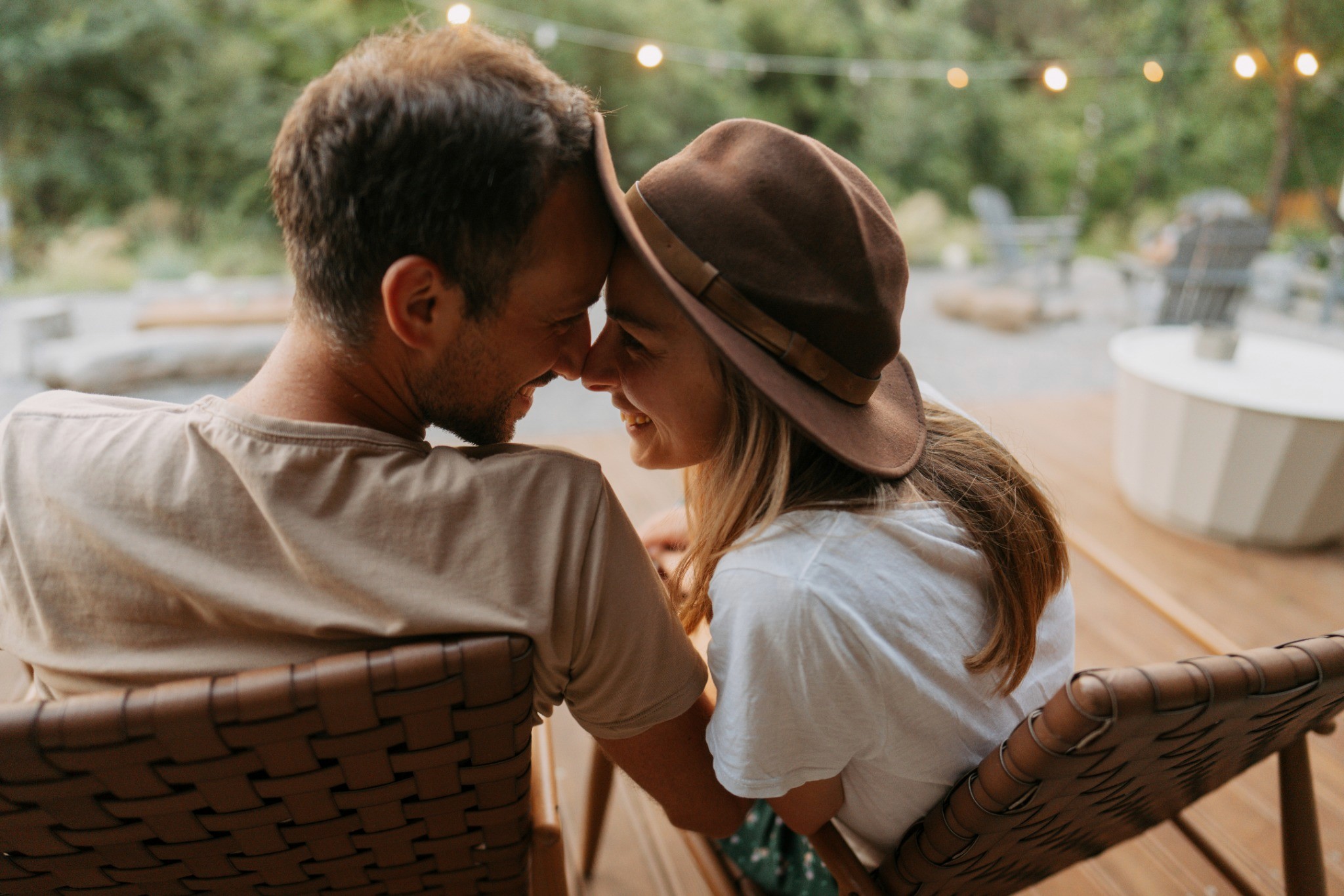 A couple sitting together outdoors